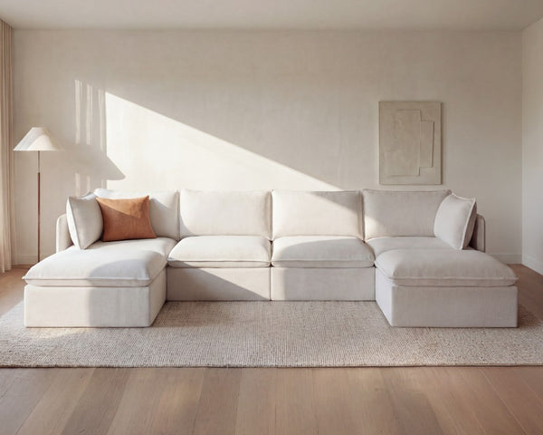 Lifestyle image of Anabei’s Modular Washable 4-Seater U-Sectional in Linen Velvet in Coco, highlighting the sister brand Anabei.