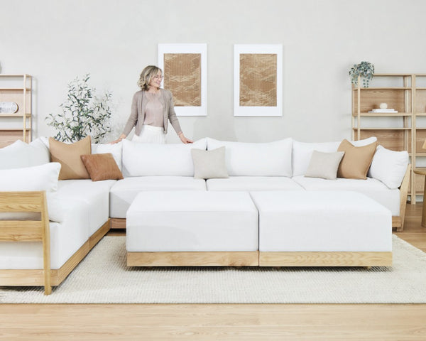 Lifestyle image of Inside Weather’s Modular Bondi Latte 6-Seater Corner Sectional with Bench Ottoman in Eggshell fabric, highlighting the sister brand Inside Weather.