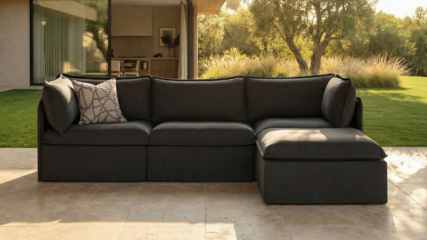 Lifestyle image of a modular 3-seater sectional in Charcoal fabric, highlighting flexible modular seating for everyday outdoor living.