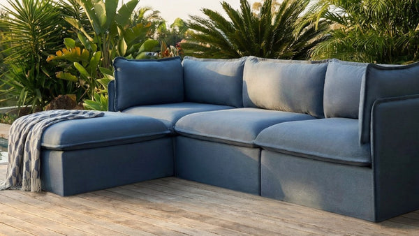 Lifestyle image of a modular 3-seater sectional in Ocean fabric, highlighting removable, machine-washable slipcovers.
