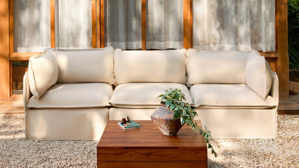 Lifestyle image of a modular 3-seater sofa in Sand fabric, highlighting washable modular seating for small outdoor spaces.