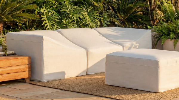 Lifestyle image of an All-Season Outdoor Protective Cover Set for a Washable 3-Seater Sofa with Ottoman, highlighting weather protection for outdoor furniture.