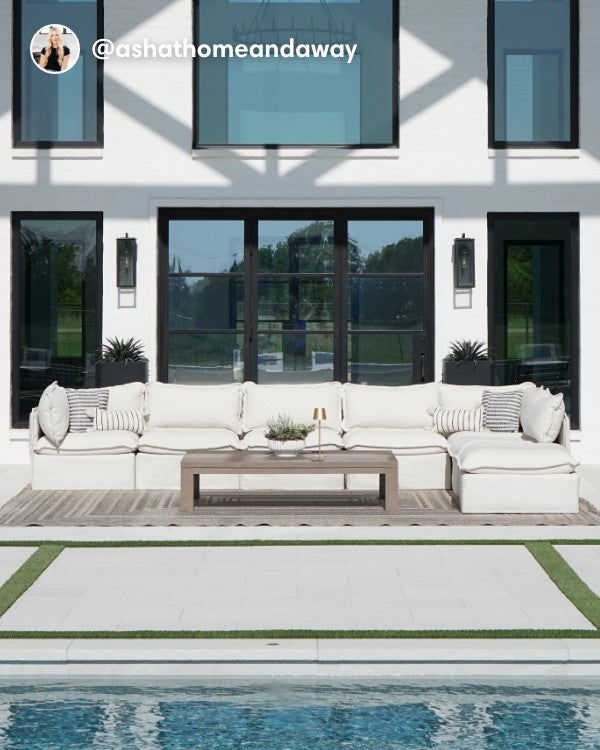 Lifestyle image of a Modular Outdoor Washable 6-Seater Open-Ends U-Sectional with Ottoman in Alfresco Boucle Creme, shown in a real customer outdoor setting.