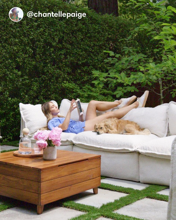 Lifestyle image of a Modular Outdoor Washable 3-Seater Sofa in Alfresco Boucle Cashew, shown in a real customer outdoor setting.
