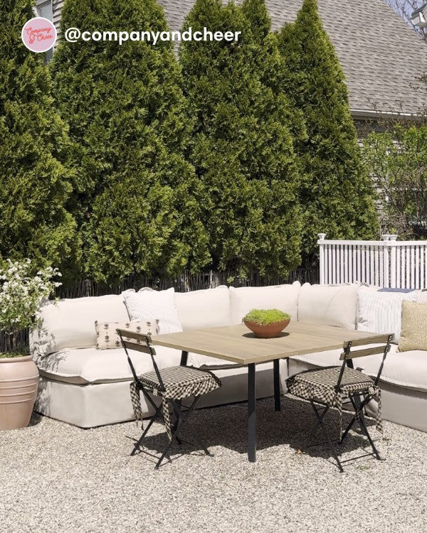 Lifestyle image of a Modular Outdoor Washable 5-Seater Open-Ends Corner Sectional in Classic Canvas Sand, shown in a real customer outdoor setting.
