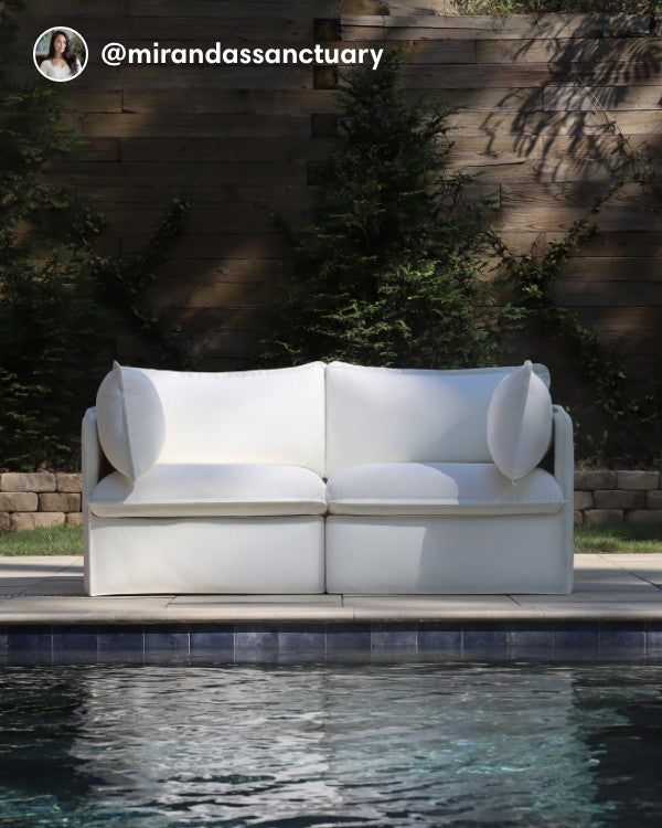 Lifestyle image of a Modular Outdoor Washable 2-Seater in Classic Canvas Cloud, shown in a real customer outdoor setting.