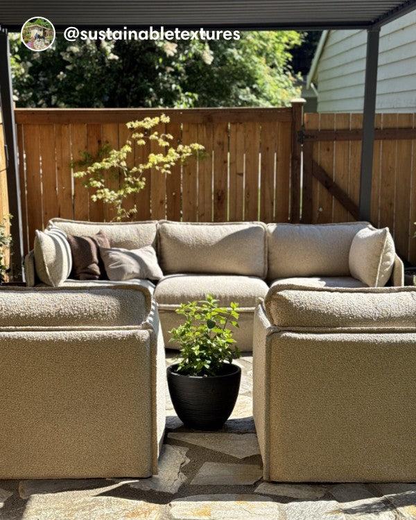 Lifestyle image of a Modular Outdoor Washable 3-Seater Sofa and Armchair Set in Alfresco Boucle Cashew, shown in a real customer outdoor setting.